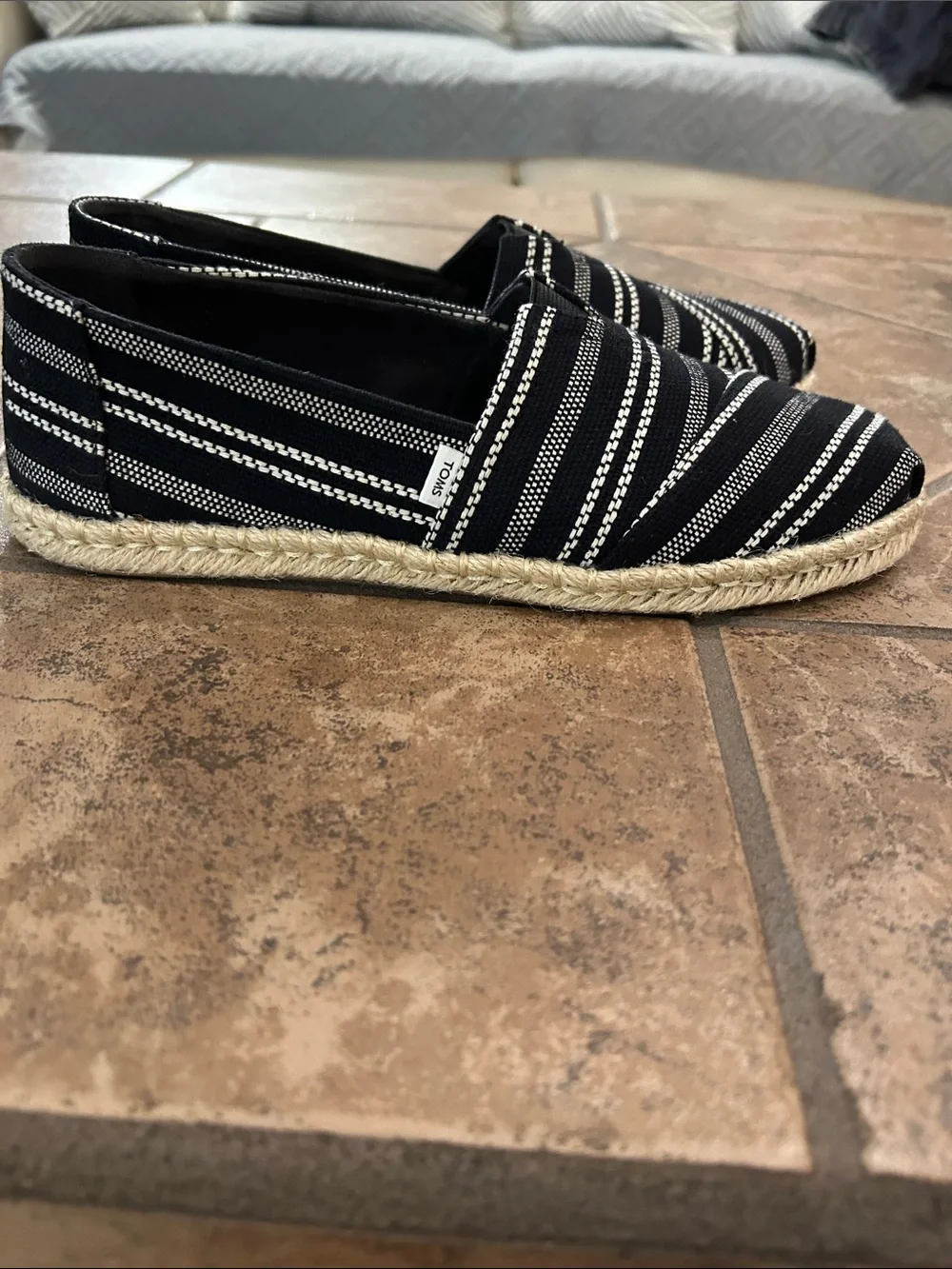 TOMS. Black striped espadrilles, size 8 and a half.  Excellent condition.